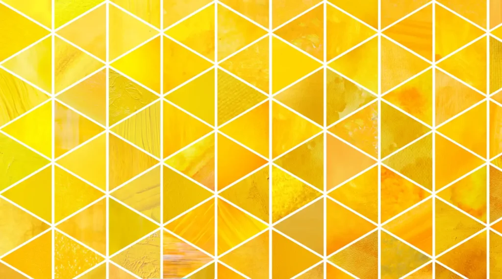 Geometric pattern of yellow triangles to complement the triangular McNaughton Digital Media logo